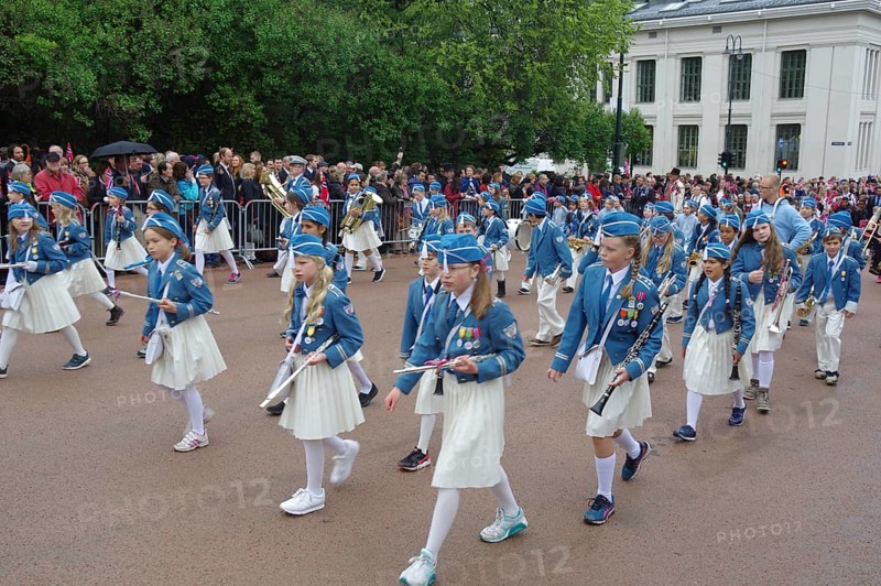 A marching band with young people walks the streets to the castle, folklore, bank holidays 17 May, Norwegian flag, Oslo, Norway, Europe