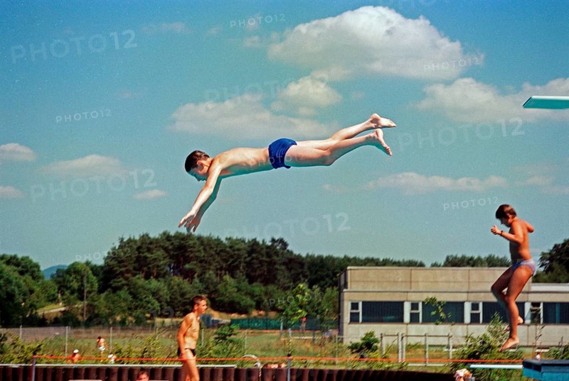 Boy jumping from three-metre board, outdoor swimming pool, Bamberg, Upper Franconia, Bavaria, Germany, 25 July 1988, vintage, retro, old, historic, Europe
