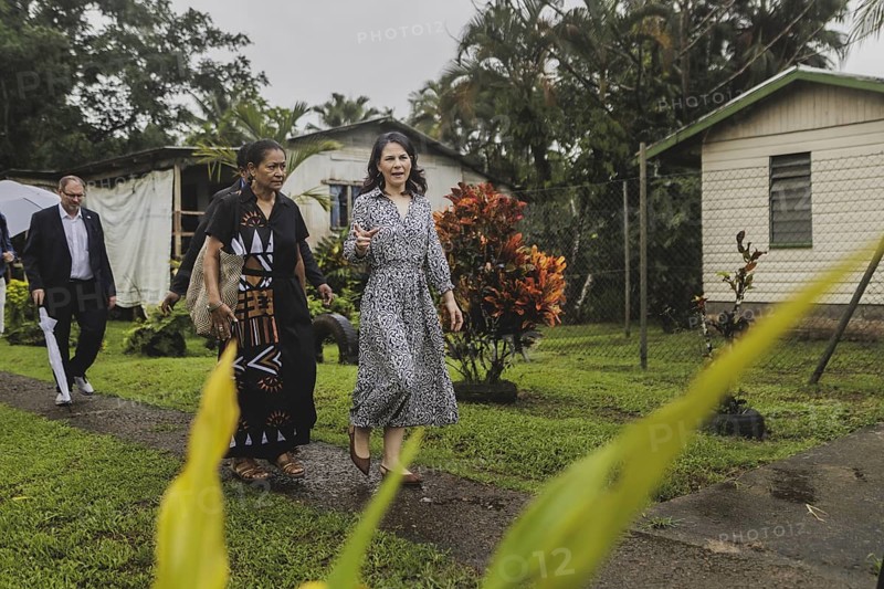 (R-L) Annalena Baerbock (Buendnis 90/Die Gruenen), Federal Foreign Minister, and Christine Fung, employee of the Deutsche Gesellschaft fuer Internationale Zusammenarbeit, photographed during a visit to the village of Vuniniudrovo, 6 May 2024. Baerbock is travelling to Australia, New Zealand and Fiji for political talks / Photographed on behalf of the Federal Foreign Office