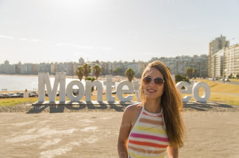 Montevideo, Uruguay, January 11, 2022, Young woman tourist landing at famous site, South America