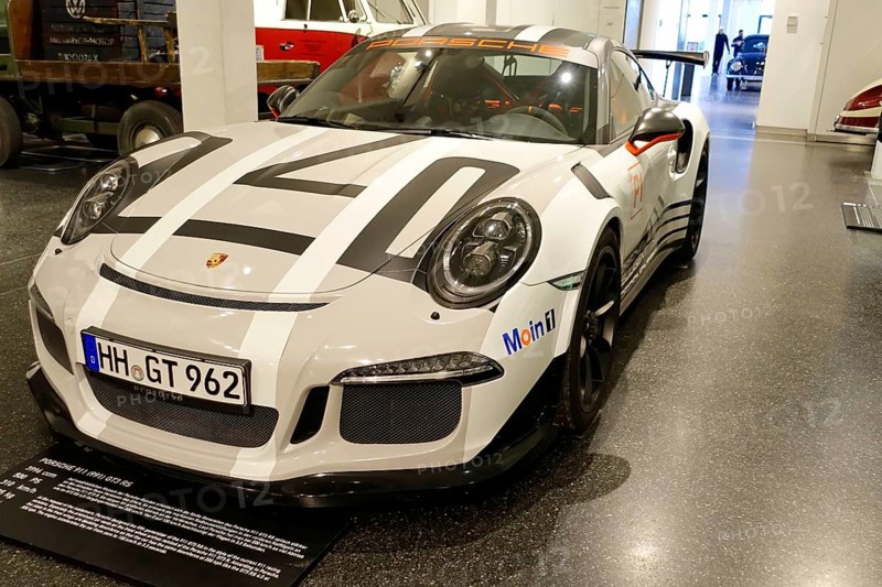 White Porsche 911 GT3 RS with racing stripes in a car show, AUTOMUSEUM PROTOTYP, Hamburg, Hanseatic City of Hamburg, Germany Europe