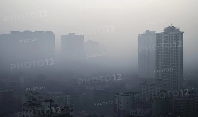 Urban landscape shrouded in smog with tall buildings barely visible AI generated