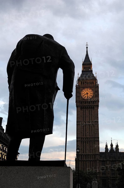 Winston Churchill statue silhouetted behind Big Ben at dusk, Bridge Street, SW1 London, England, United Kingdom, Europe
