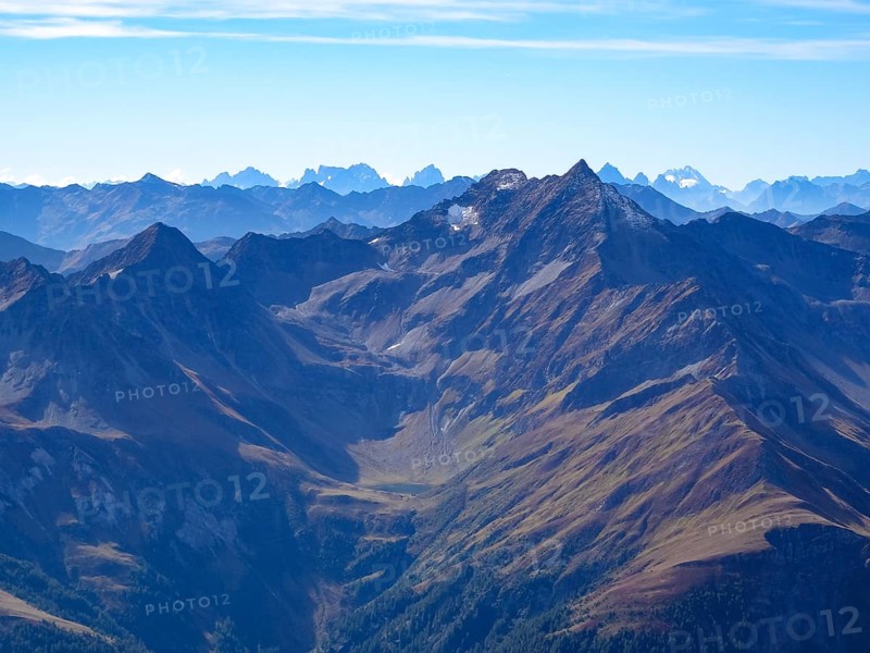 View from the Kreuzspitze to the Lasoerling, with the Dolomites on the horizon, East Tyrol, Austria, Europe