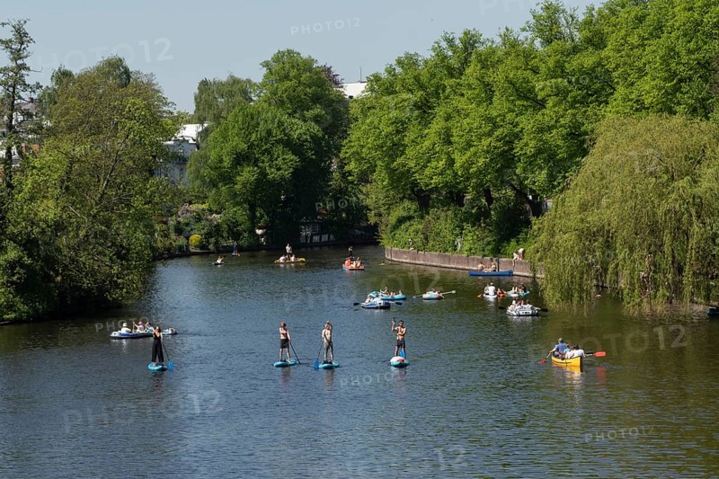 Symbolic picture weather, leisure activity, summery spring, view from the Krugkoppelbruecke with rowing boats, pedal boats and stand up paddling against a blue sky on the Alster in Hamburg, Germany, Europe