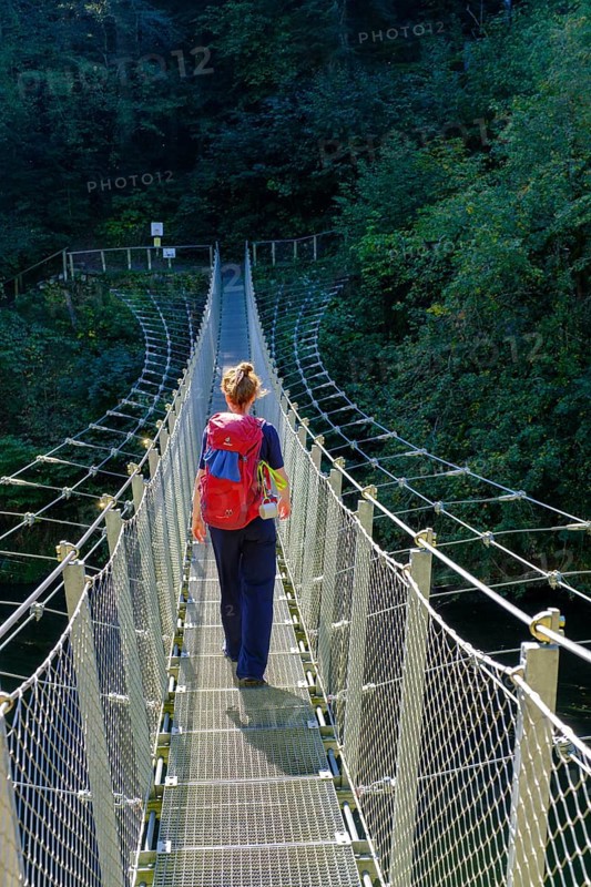 Hikers at the suspension bridge over the Danube, Inzigkofen Princely Park near Sigmaringen, Upper Danube Valley, Baden-Wuerttemberg, Germany, Europe
