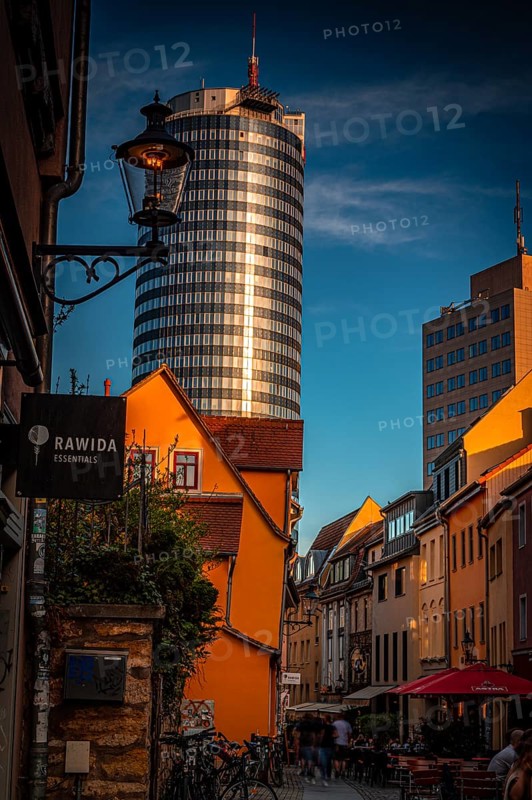 The restaurant alleyway Wagnergasse with the Jentower in the background at sunset and blue sky, Jena, Thuringia, Germany, Europe