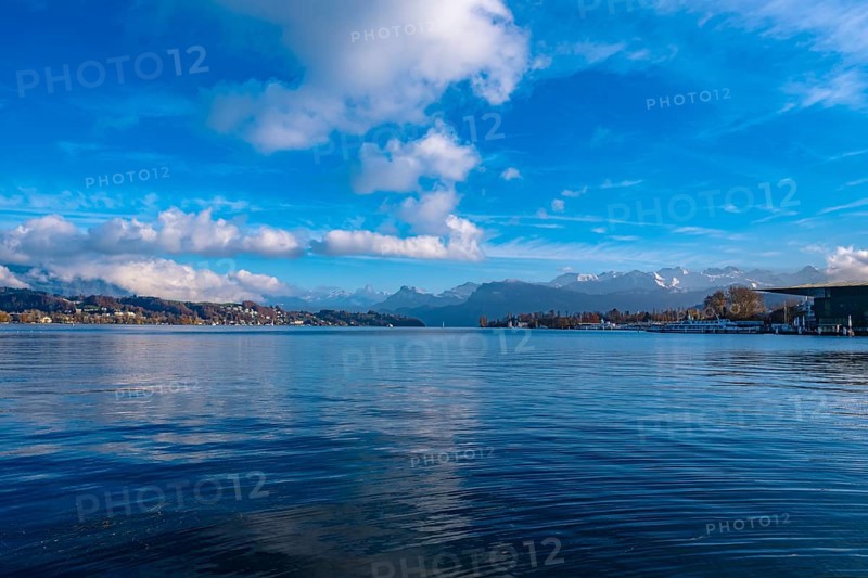 Lake Lucerne with mountain landscape in the background and blue sky with clouds, Lucerne, Switzerland, Europe