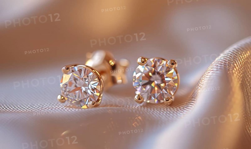 Pair of intricately crafted diamond stud earrings placed on a smooth satin material background AI generated