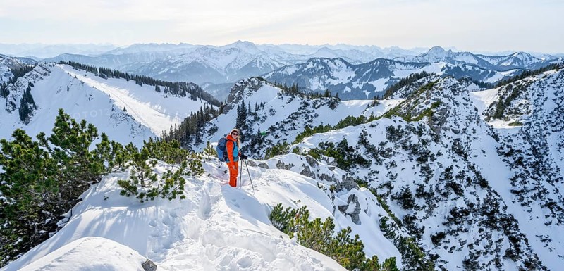 Hiker in winter climbing the Aiplspitz, Mangfall mountains, Bavarian Prealps, Bavaria, Tyrol, Germany, Europe