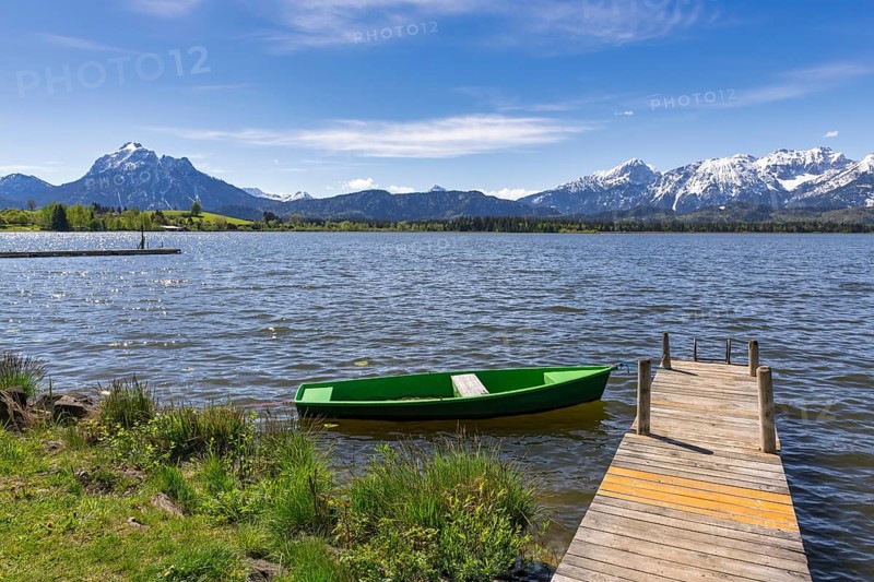 Jetty with boat on Lake Hopfensee, fishing boat, Allgaeu Alps, Hopfen am See, snow, Ostallgaeu, Bavaria, Germany, Europe