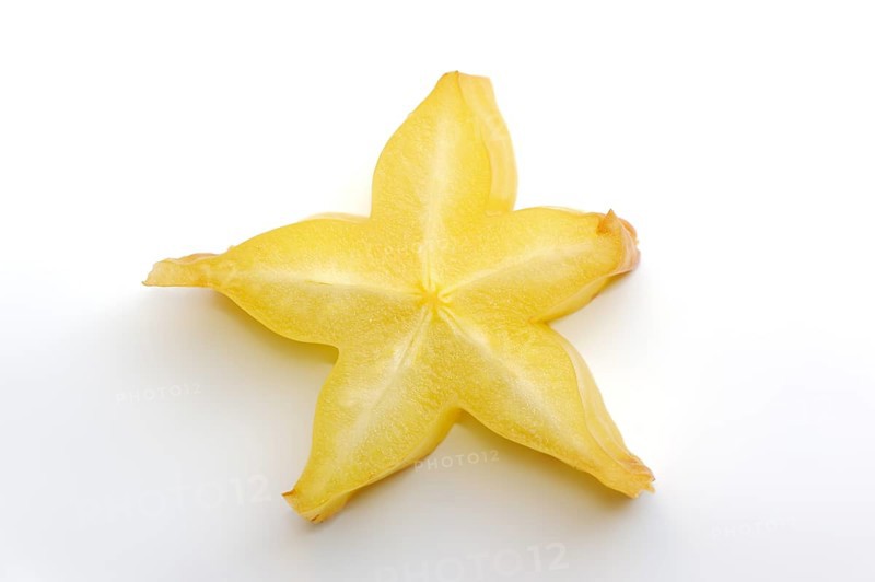 Star fruit or carambola (Averrhoa carambola), sliced fruit on a white background