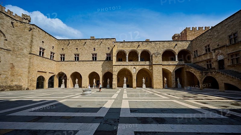 Wide angle shot of a sunny courtyard with arches and columns in a castle, courtyard, Grand Master's Palace, Knights' Town, Rhodes Town, Rhodes, Dodecanese, Greek Islands, Greece, Europe