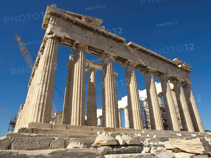 Close-up of the Parthenon with its classical columns under a clear sky, historical columns and ruins at an ancient site against a blue sky, Athens, Greece, Europe