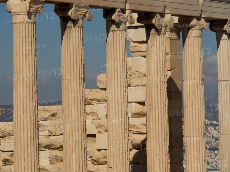 Close-up of ancient marble columns with a clear sky in the background, historical columns and ruins at an ancient site against a blue sky, Athens, Greece, Europe