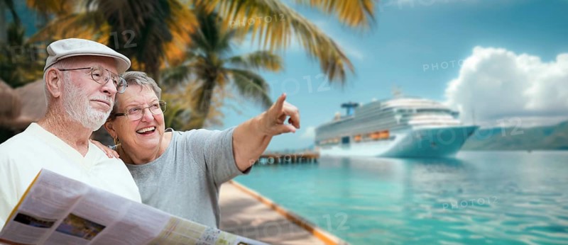Senior adult couple enjoying the view from the dock with passenger cruise ship in the background