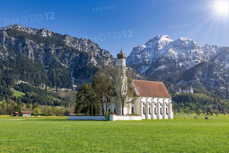 Pilgrimage church of St Coloman in spring, sun, behind Neuschwanstein Castle, Schwangau, Fuessen, Ostallgaeu, Allgaeu, Swabia, Bavaria, Germany, Europe