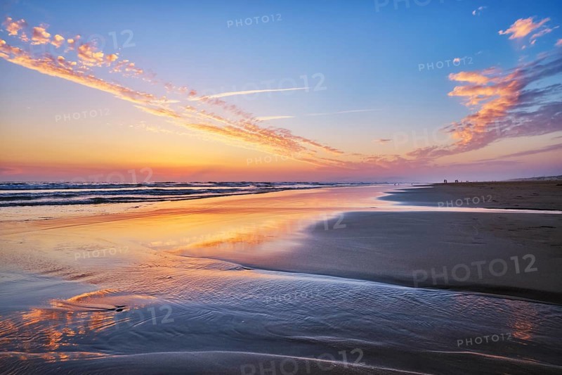 Atlantic ocean after sunset with surging waves at Fonte da Telha beach, Costa da Caparica, Portugal, Europe