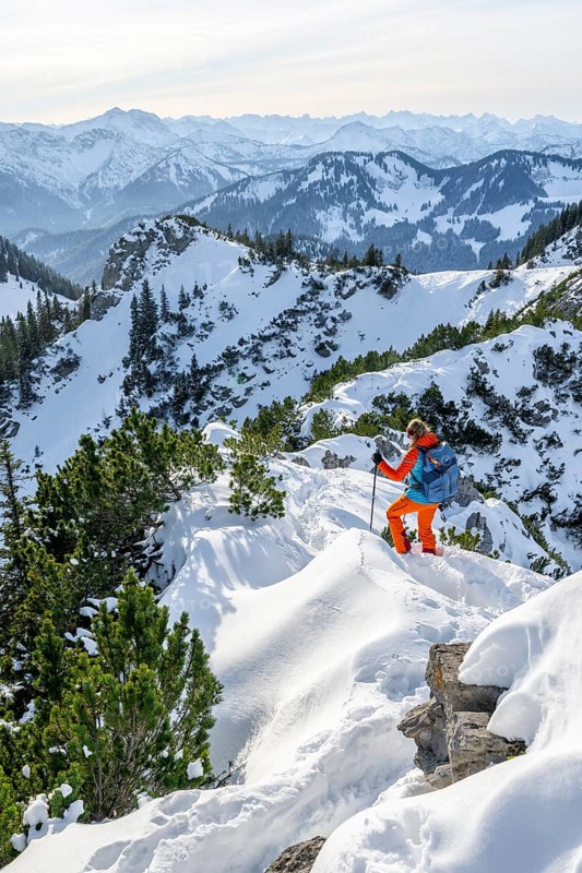 Hiker in winter climbing the Aiplspitz, Mangfall mountains, Bavarian Prealps, Bavaria, Tyrol, Germany, Europe
