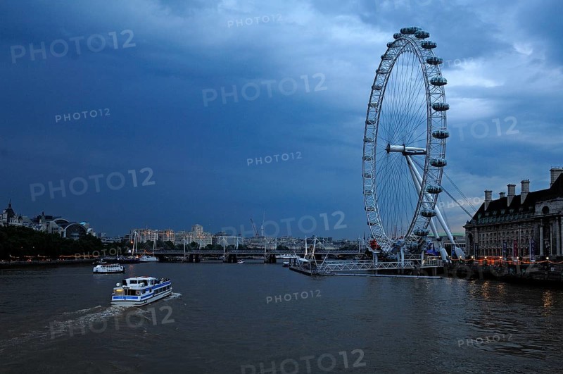 Ferris wheel (135m high) on the Thames near Westminster Bridge at dusk, London, England, Great Britain