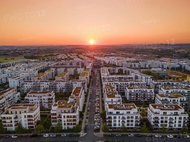 The sun rises over the Riedberg district of Frankfurt. (Aerial view with a drone), Riedberg, Frankfurt am Main, Hesse, Germany, Europe
