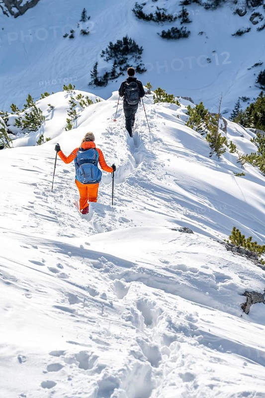 Hikers in winter descending the Aiplspitz, Mangfall mountains, Bavarian Prealps, Bavaria, Tyrol, Germany, Europe