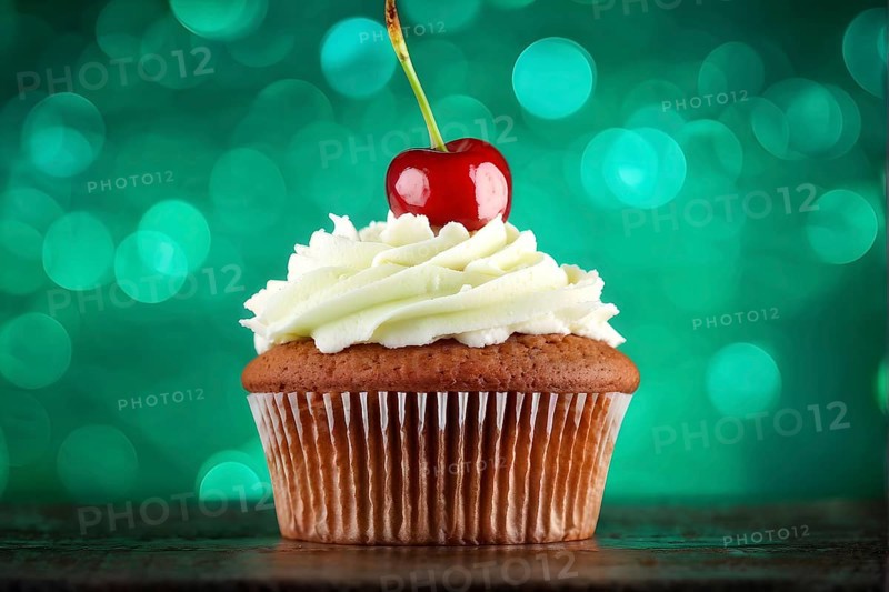 Cupcake with a swirl of vanilla frosting atop a delicate cherry against green background, AI generated