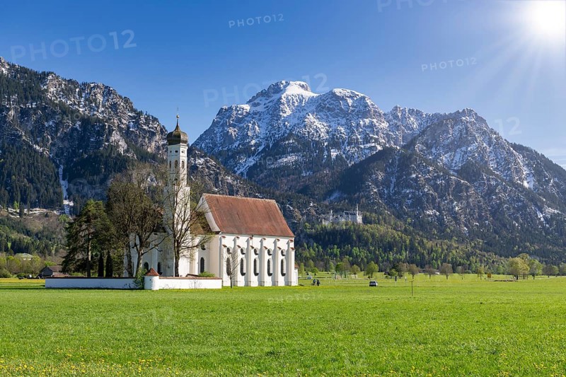 Pilgrimage church of St Coloman in spring, sun, behind Neuschwanstein Castle, Schwangau, Fuessen, Ostallgaeu, Allgaeu, Swabia, Bavaria, Germany, Europe