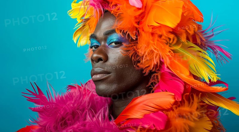A transgender LGBTQ man wearing a colorful feathery costume with blue, yellow, and red feathers, AI generated