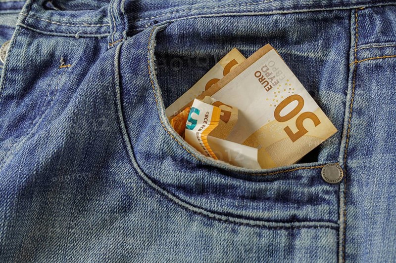 Jeans with euro banknotes coming out of the pocket