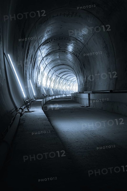 An empty tunnel with cold metallic walls and artificial lighting that creates a futuristic atmosphere, Tunnelbau Hermann Hesse Bahn, Ostelsheim, Germany, Europe