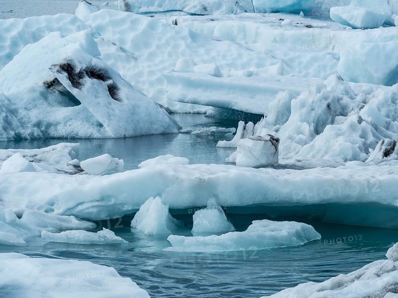 Glacier landscape with snow-covered icebergs and an ice-cold watercourse, Ice Lake, Iceland, Europe