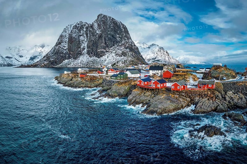 Hamnoy fishing village with red rorbu houses in Norwegian fjord in winter. Lofoten Islands, Norway, Europe