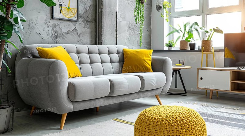 Modern living room in a condo or loft with modern trendy furniture a grey couch and yellow pillows, AI generated