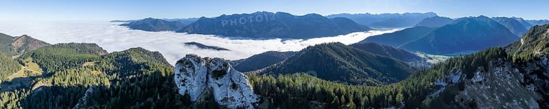 Aerial view, rocky summit of the Ettaler Manndl, view over mountain landscape and sea of clouds, high fog in the valley, Ammergau Alps, Bavaria, Germany, Europe