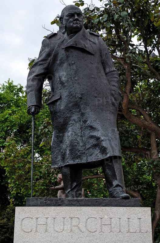 Bronze statue of Churchill with a walking stick in a park, London, England, Great Britain