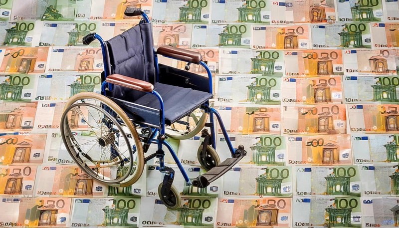 Symbolic long-term care insurance, care costs, disability, a wheelchair stands on a surface of euro notes, money, AI generated, AI generated