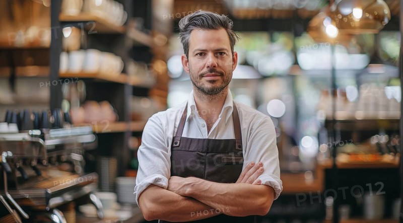 Small business owner stands in front of a counter with apron on and a smile on his face, AI generated