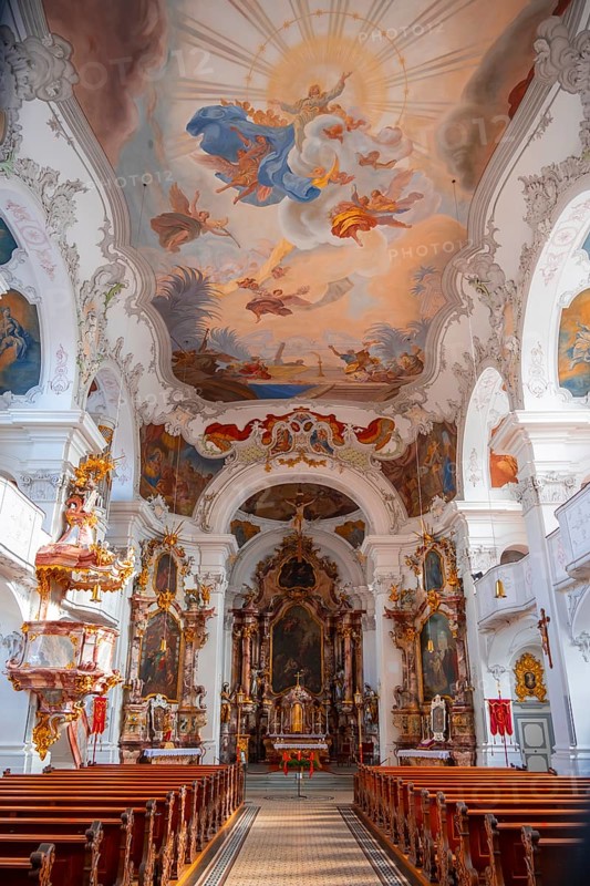 Interior of a baroque church with an elaborate ceiling fresco and a magnificent gilded altar, interior view of the Catholic parish church, Minster of Our Lady, Lindau Island, Lake Constance, Bavaria, Germany, Europe