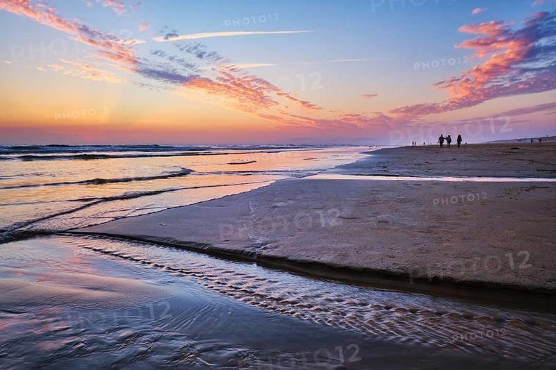 Atlantic ocean after sunset with surging waves at Fonte da Telha beach, Costa da Caparica, Portugal, Europe