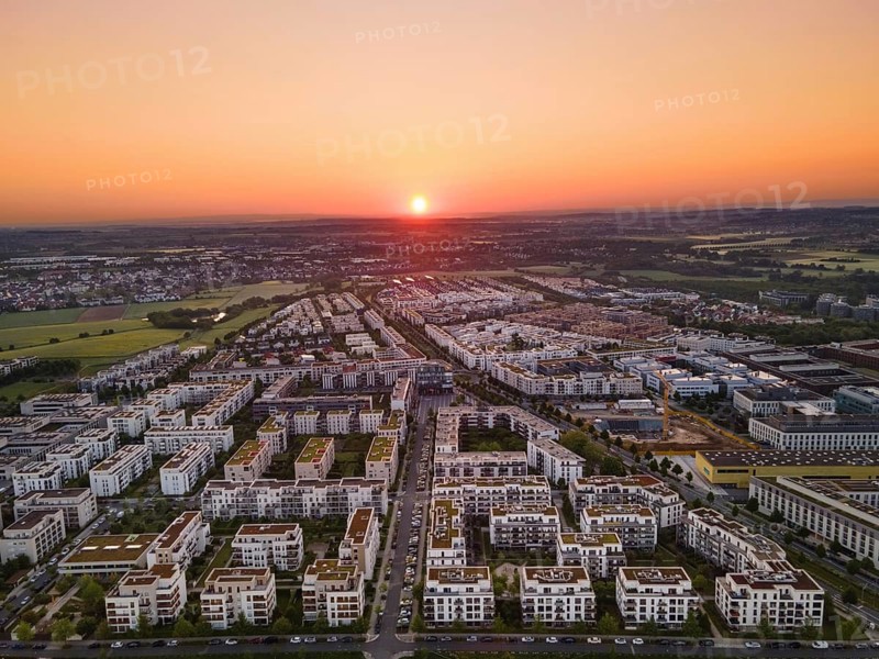 The sun rises over the Riedberg district of Frankfurt. (Aerial view with a drone), Riedberg, Frankfurt am Main, Hesse, Germany, Europe