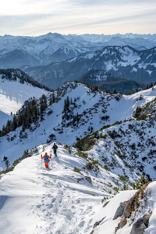 Hikers in winter descending the Aiplspitz, Mangfall mountains, Bavarian Prealps, Bavaria, Tyrol, Germany, Europe