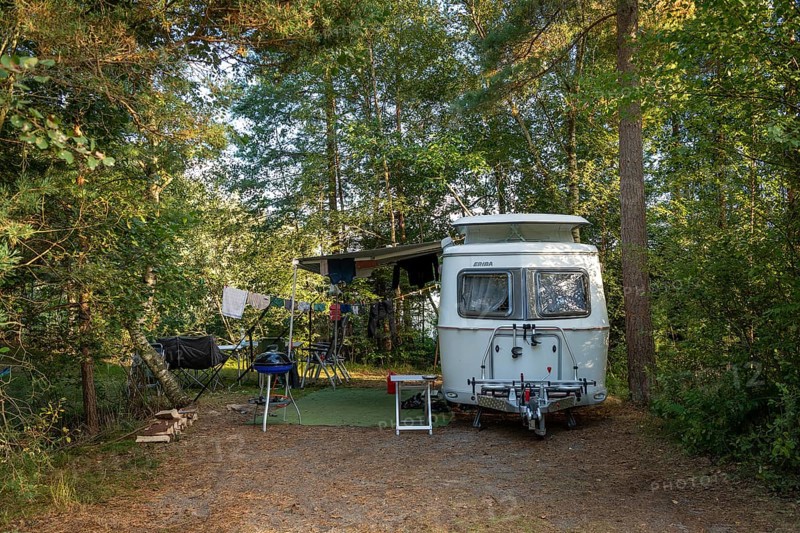 Eriba caravan on a campsite in the forest, Haettaboda Vildmarkscamping, Urshult, Sweden, Europe