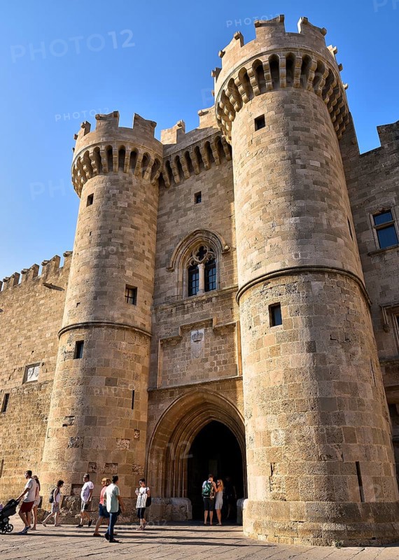 Super wide angle shot, portrait format, picture of a busy old castle with visitors on a sunny day, main portal, Grand Master's Palace, Knights' Town, Rhodes Town, Rhodes, Dodecanese, Greek Islands, Greece, Europe