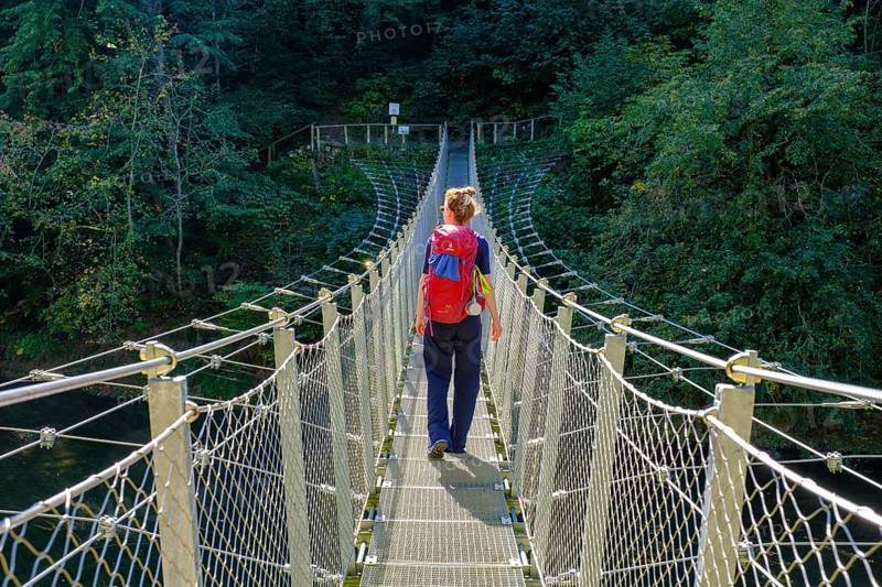 Hikers at the suspension bridge over the Danube, Inzigkofen Princely Park near Sigmaringen, Upper Danube Valley, Baden-Wuerttemberg, Germany, Europe