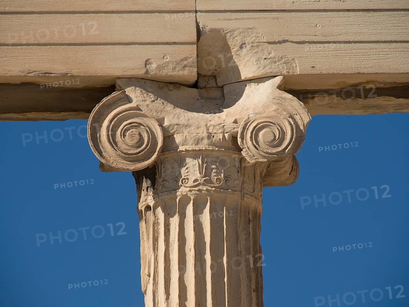 Single marble capital and its details in close-up against a clear blue sky, historical columns and ruins at an ancient site against a blue sky, Athens, Greece, Europe