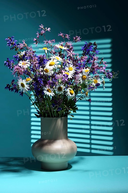 Vase with bouquet of wildflowers