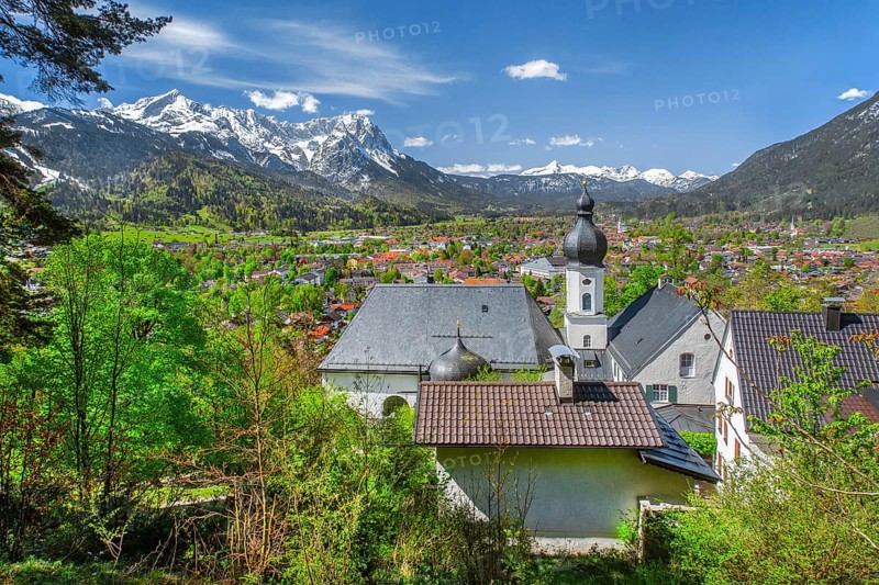 Pilgrimage church St. Anton in spring above the village in front of the Zugspitze group 2962m in the Wetterstein mountains, Garmisch-Partenkirchen, Loisachtal, Werdenfelser Land, Bavarian Alps, Upper Bavaria, Bavaria, Germany, Europe