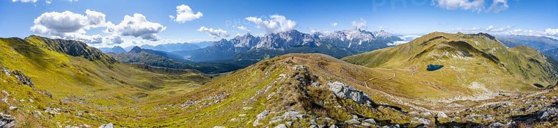 Panorama, hiking trail between green mountain meadows on a mountain ridge, mountain panorama, view of rocky mountain peaks of the Sesto Dolomites, Carnic main ridge, Carnic High Trail, Carnic Alps, Carinthia, Austria, Europe
