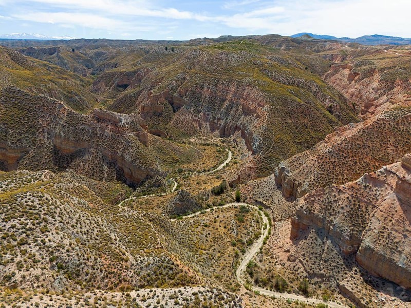 Wide views of hilly rocks and canyons, criss-crossed by winding paths, aerial view, Los Coloraos, Grand Canyon of Andalusia, Gorafe desert, Granada, Andalusia, Spain, Europe